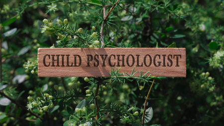 child psychologist written on the surface. Wooden man and medicine concept.の写真素材
