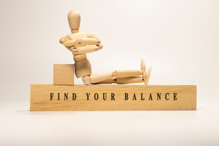 FIND YOUR BALANCE is written on the wooden surface. Wooden Concept.の写真素材