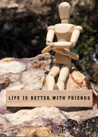LIFE IS BETTER WITH FRIENDS was written on the wooden surface. Wooden Concept.の写真素材