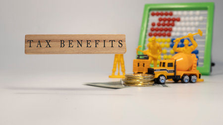 TAX Benefits text. It was taken in the studio written on a wooden frame. white background.の写真素材