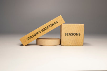 The phrase Season's Greetings was written. Wooden concept studio shoot.の写真素材