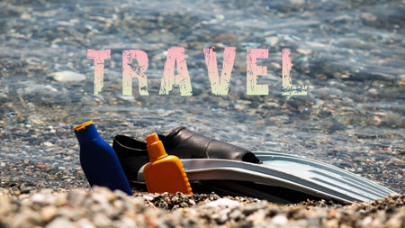 Travel word. Glasses palette and sunscreen concept on the beachの写真素材