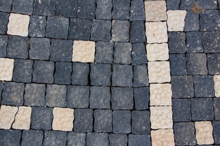Background texture of cobblestone pavement. Paving slabs in the form of a square.Close up view of paving slabs.の写真素材