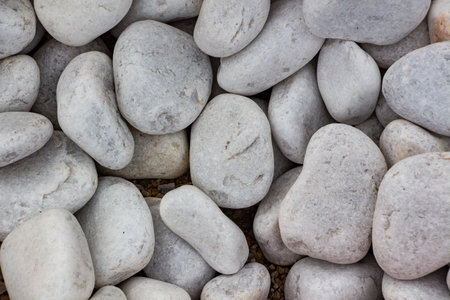 Background of stone pebbles. Texture of stone pebbles. Abstract background and texture for design. Gravel ground texture background, close up of gravel in the gardenの写真素材