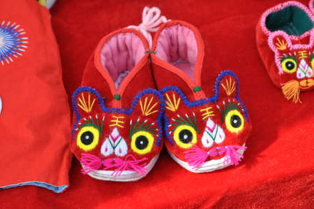 Handicraft tiger shoes. A traditional pair of shoes.の写真素材