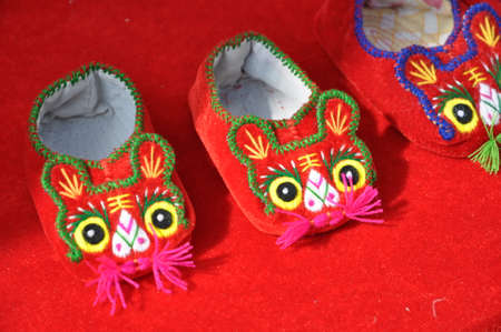 Handicraft tiger shoes. A traditional pair of shoes.の写真素材