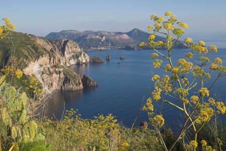 Quattrocchi is one of the nicest views on the Isle of Lipari. In the Distance the Isle of vulcano with its crater. A few smoke coming out.の写真素材