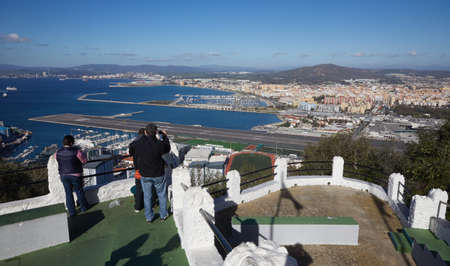 Gibraltar, view from Upper Rock to the north, airport with landing strip and the main crossroad, border with Spain with the place La Linea de la Conception,のeditorial素材