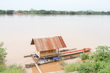 Houseboat on river of thailandの写真素材