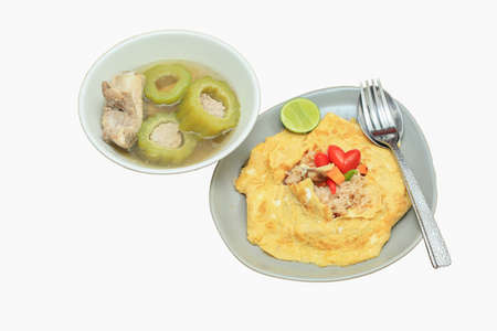 flavored fried rice in an omelet wrapping with pork in balsam apple soup
