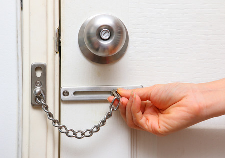 chain lock and knob lock in door for protect home