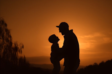 Silhouette of father and son on sunset background. Happy family concept. Happy Father's Day, father and son conceptの素材