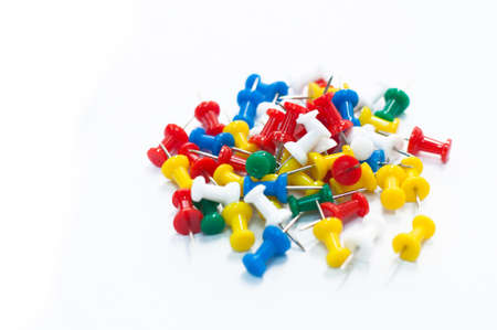 Colorful pins on whtie backgroundの写真素材