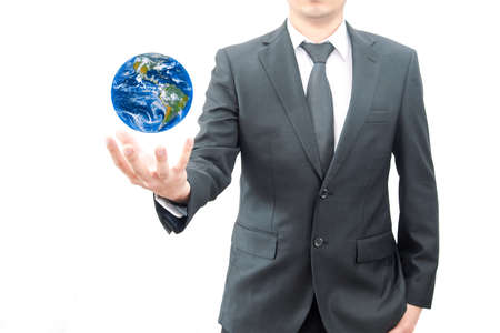 Businessman holds Earth in a hand.