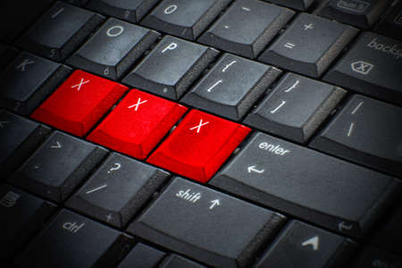 Red button Keywords xxx on keyboard computer, Adult sex online conceptの写真素材