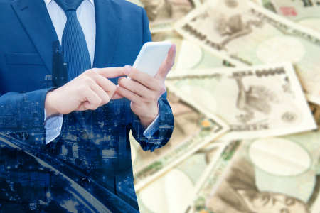 Double exposure of businessman and cityscape with Japanese Yen bank note pile background, Business...