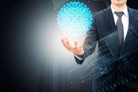 Double exposure of hand businessman and servers technology in data center with cyber world connection networkの写真素材