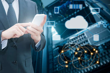 Double exposure of professional businessman connecting cloud internet smart phone with servers and cloud technology connect world network in Information Technology & Business concept,の写真素材