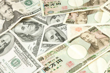 Japanese Yen and USD Dollar Bank note pile, Business and finance conceptの写真素材