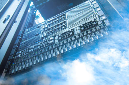 Cloud and sky overlay with servers computing technology in datacenter creative cloud conceptの写真素材