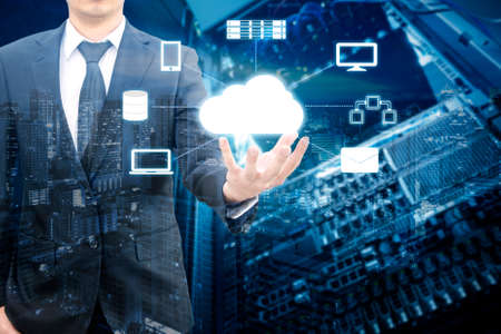 Double exposure of professional businessman connecting network on hand in Cloud technology,...