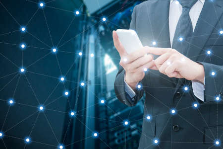 Double exposure of professional businessman using smart phone and network connection with server datacenter in communication , technology and business conceptの写真素材