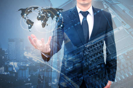 Double expoure of professional businessman connecting internet network on hand with servers computer & storage technology in Technology, Communication and business concept,の写真素材