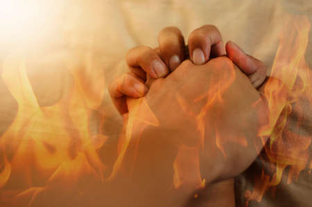 Double exposure of a couple hand having hot sex and fire on a bed, Hot sex erotic conceptの写真素材