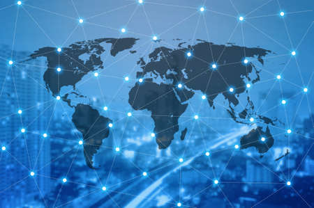 Double exposure of world map connecting and blurred cityscape of business centre , Technology and network connection conceptの写真素材