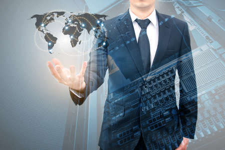 Double expoure of professional businessman connecting internet network on hand with servers computer & storage technology in Technology, Communication and business concept,の写真素材