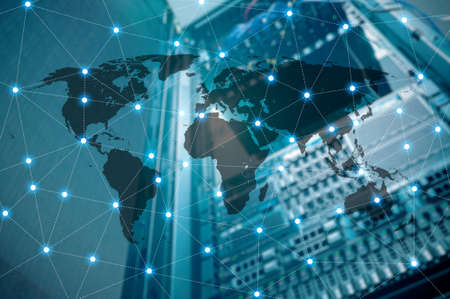 Double exposure of world map connecting and blurred data center of server and storage with internet , Technology and network connection concept ,の写真素材