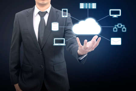 Professional businessman connecting network on hand in Cloud technology, communication and business conceptの写真素材