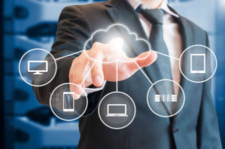 Professional businessman touch digital screen cloud connectivity with devices in Technology and...