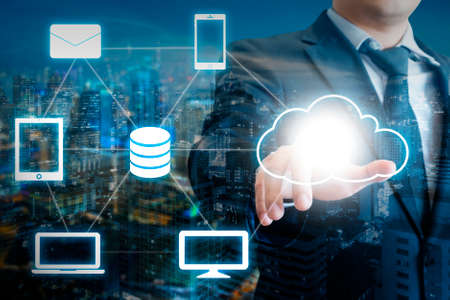 Professional businessman touch digital screen cloud connectivity in Technology and business conceptの写真素材