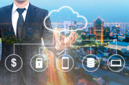 Double exposure of professional businessman connected Cloud technology with internet and wireless...