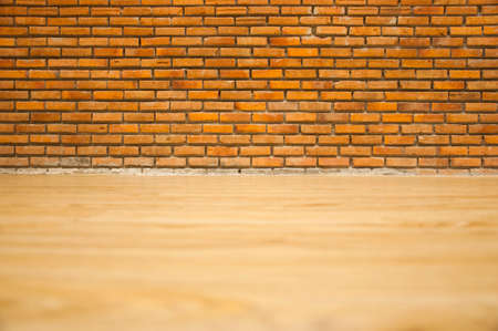 Vintage or Retro brick wall and wood floor in loft style decorative in house office or shopping mall