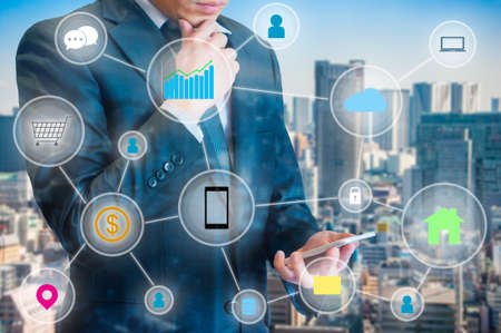 Businessman connected network for link internet of things easy to managed lifestyle on his smart...