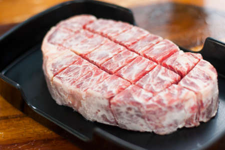 Close up freeze sirloin beef on dish prepare before grill steakの写真素材