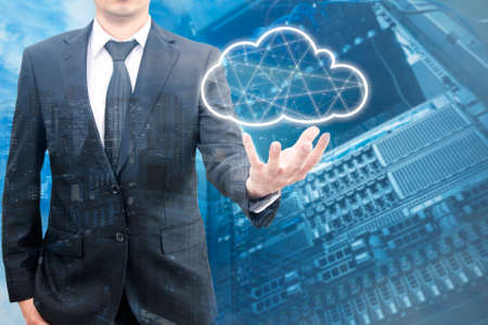 Double exposure of professional businessman connecting network and database on hand in technology,...