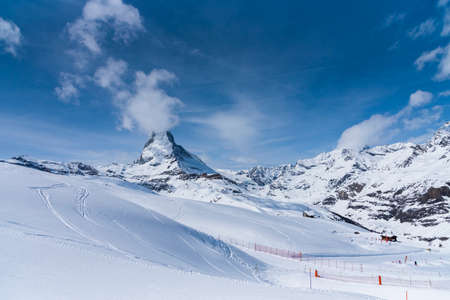 The famous mountain Matterhorn peak with cloudy and blue sky from Gornergrat, Zermatt, Switzerlandの写真素材