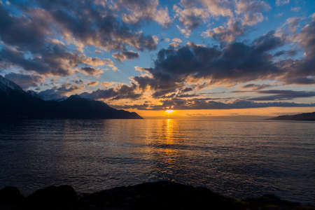Beautiful sunset and snow mountains at famous Chateau de Chillon, Lake Genevaâ, Switzerlandの写真素材