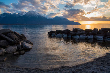 Beautiful sunset and snow mountains at Lake Genevaâ€Ž, Montreux, Switzerland