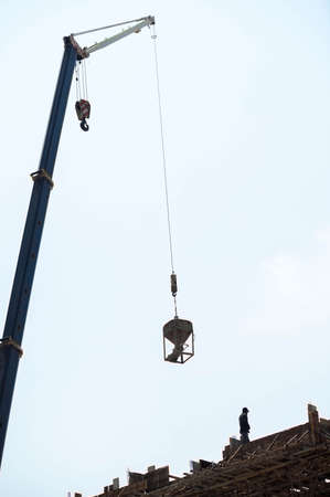 Workers on the deck and the crane の写真素材