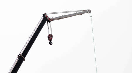 Cranes with rope hoists and lifting heavy objects の写真素材