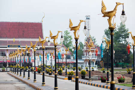Entrance in the temple lighting side adorned with stucco swan の写真素材