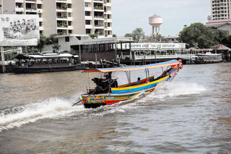 Boats on the river and buildings in the city center of Thailand のeditorial素材