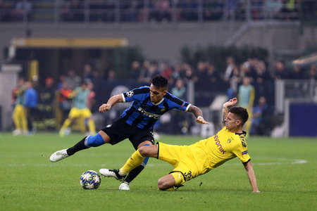 Milan, Italy. 23th October 2019. Uefa Champions League. Fc Internazionale vs Borussia 09 Dortmund. Lautaro Martinez of Fc Internazionale and Julian Weigl of Borussia Dortmund Milan, Italy.のeditorial素材