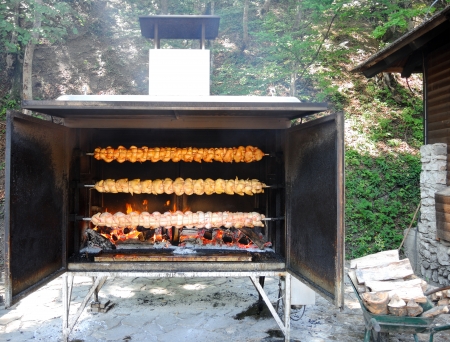 Rows of chickens in mega big barbecue.の写真素材