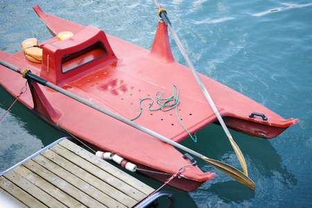 Red lifeguard boat on a lake.の写真素材