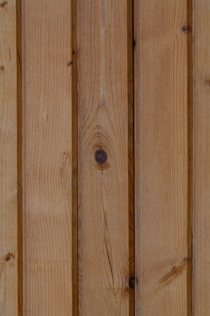 structural background of old, laminated, wooden board in a vertical planeの写真素材